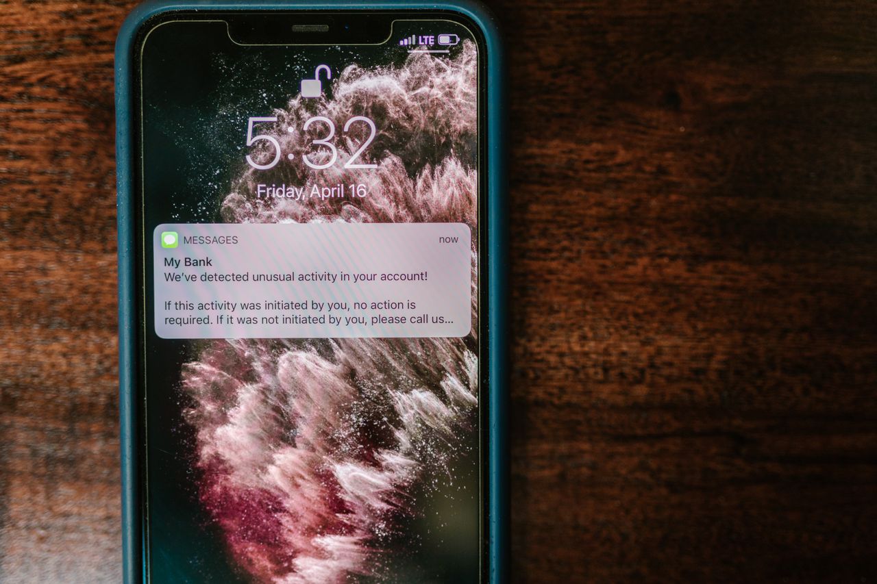 A phone indicating that unusual activity has been detected at the bank