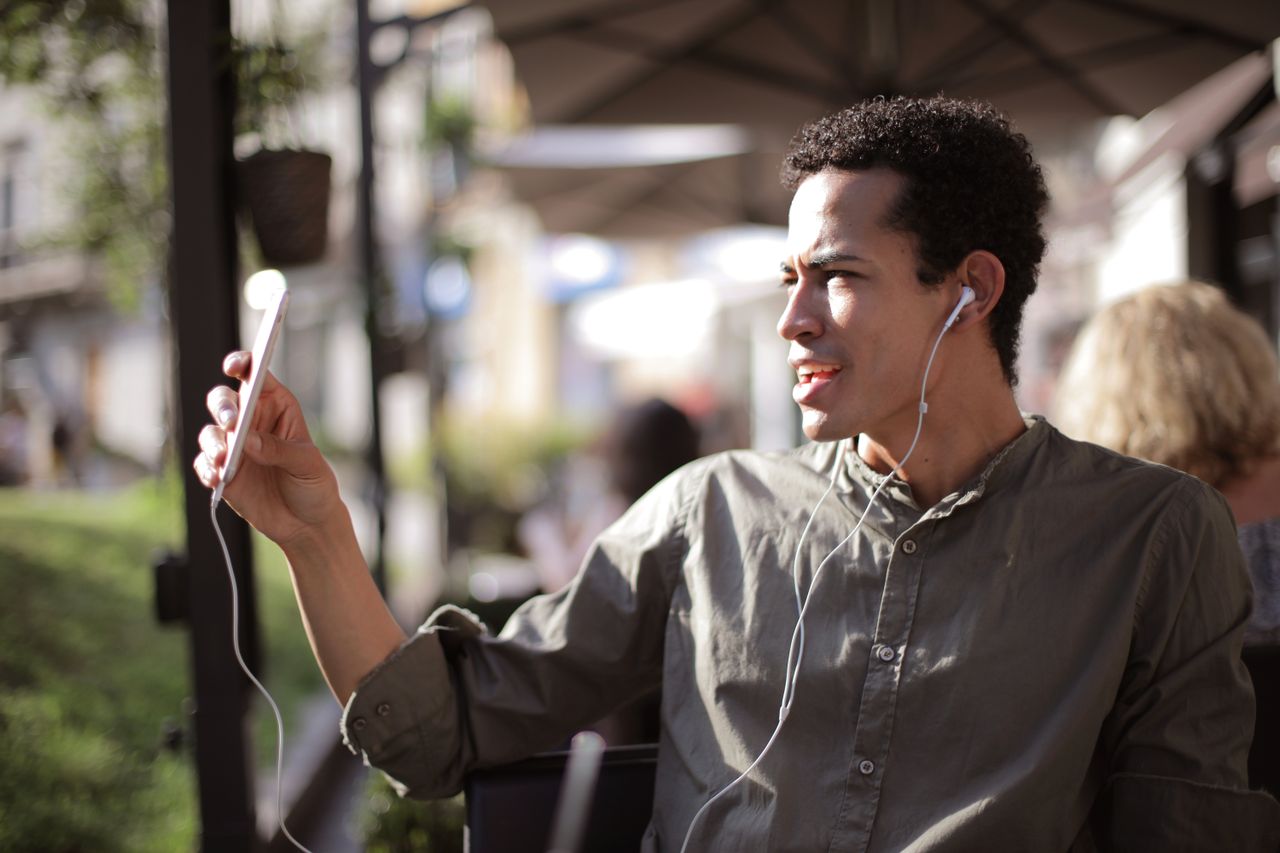 A man using his phone to chat with someone new